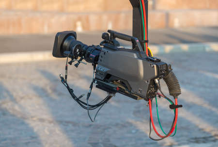 Professional video camera on crane on crane shooting on eventの写真素材
