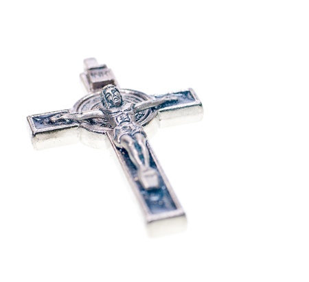 A metal Crucifix close up close up on white backgroundの写真素材