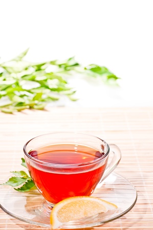Hot lemon tea in a glass cupの写真素材