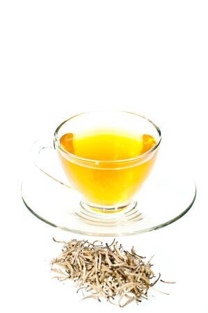 Silver tips tea in a cup isolated on white backgroundの写真素材
