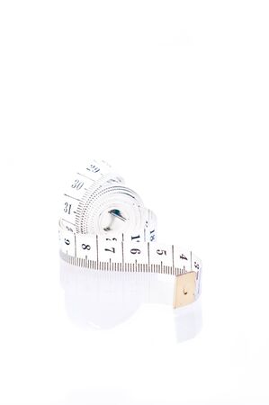 Black and white tape measure on white backgroundの写真素材