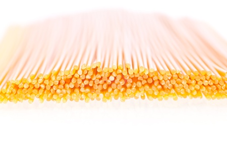 Dry Italian pasta on white backgroundの写真素材