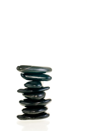 A stack of balanced zen stones isolated on white backgroundの写真素材