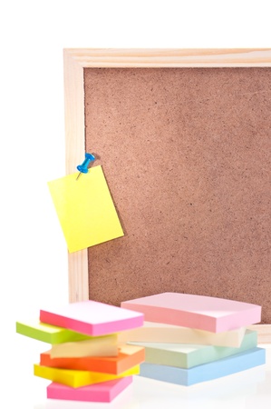 Cork board with sticky notes and padsの写真素材