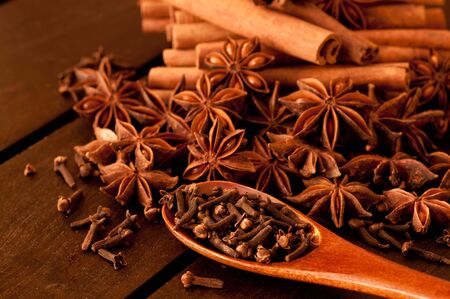Various spices on a wooden tableの写真素材