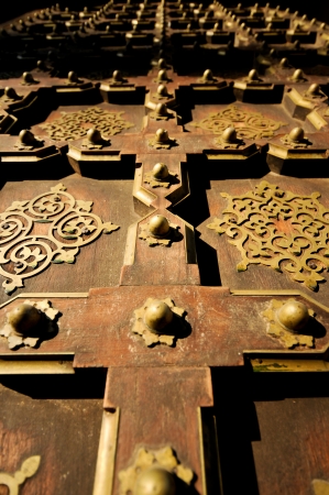 Old wood and brass door in Jaipur India close upの写真素材