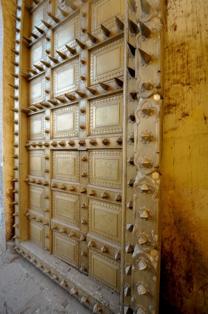 Spiky brass door at a fort in Indiaの写真素材