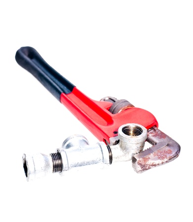 Pipe wrench fixing a tap joint fittings with a plumbing conceptの写真素材