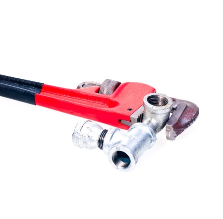 Pipe wrench fixing a tap joint fittings - concept   plumbingの写真素材