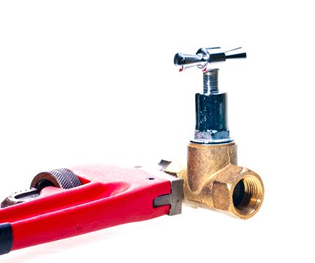 Pipe wrench holding brass tap pipe fittingsの写真素材