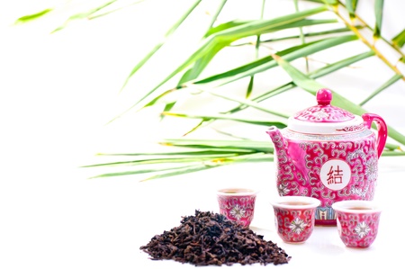 Porcelain Chinese tea set with a bamboo backgroundの写真素材
