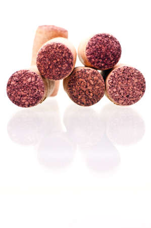 Five wine corks in focus over whiteの写真素材