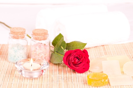 Romantic spa concept with rose, bath salt and soapsの写真素材