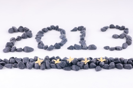Year 2013 in zen stones and yellow Ixora flowersの写真素材