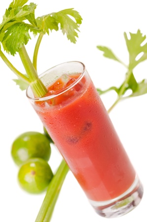 Bloody Mary cocktail with lime and celery background, made from vodka, tomato juice, lime juice, tabasco, salt and pepper to taste の写真素材