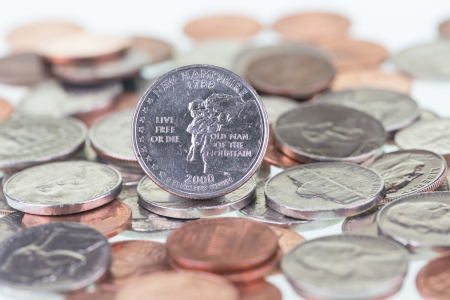 New Hampshire State Quarter extreme close up with coins background の写真素材