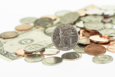 New York State Quarter with dollar and coins close upの写真素材
