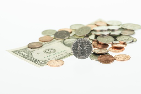New York State Quarter with dollar and coins close upの写真素材
