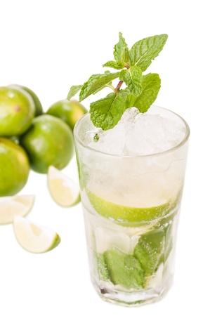 Mojito cocktail with fresh limes at the background の写真素材