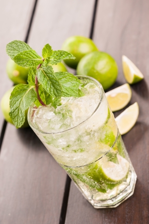 Mojito cocktail on a wooden table top view close up の写真素材