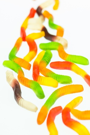 Gummy worms candy close up over white backgroundの写真素材