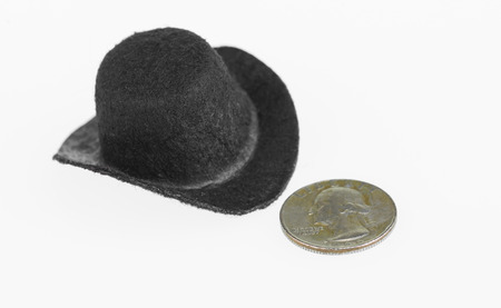Cowboy hat and old quarter close up over white backgroundの写真素材