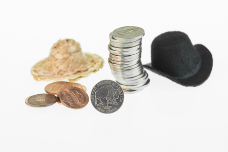 American Bison nickel with cowboy hat, straw hat and coins close up の写真素材