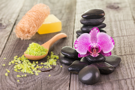 Moth orchid, bath salt and black stones close-upの写真素材