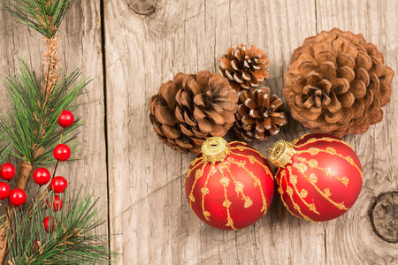 Christmas baubles and pine cones top viewの写真素材