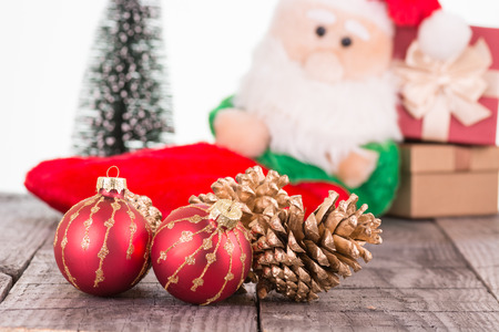 Red Christmas baubles and golden pine conesの写真素材