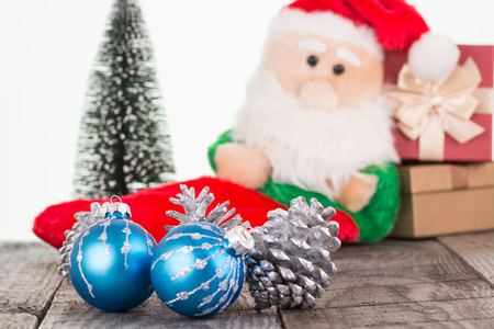 Christmas baubles and Santa Claus toy close-upの写真素材