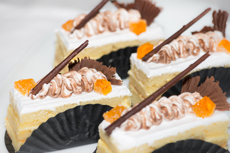 Almond sliced cakes with chocolate garnish close-upの写真素材