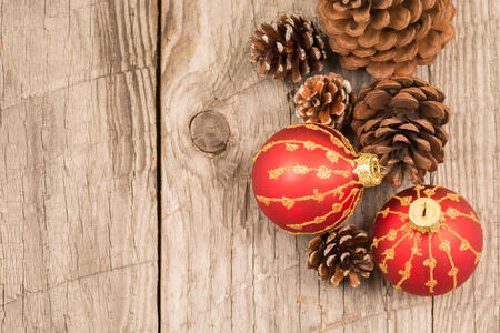 Christmas baubles and pine cones top viewの写真素材