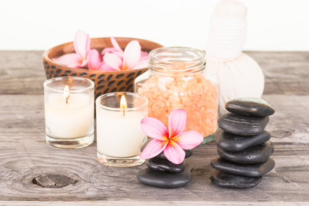 Traditional herbal spa with hot compress ball, bath salt and stonesの写真素材