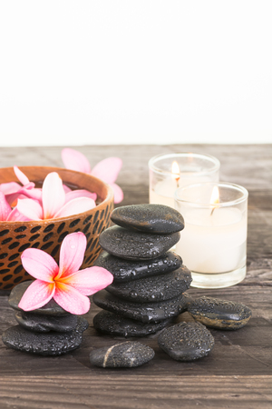 Spa with Frangipani flowers, black stones and candlesの写真素材