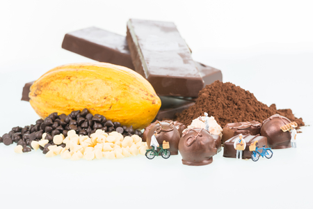 Miniature pastry chefs and cocoa over white backgroundの写真素材