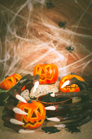 Halloween witch hands and Jack-O-Lantern pumpkin ornamentsの写真素材