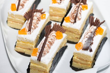 Vanilla sliced cakes with chocolate and orange marmalade garnishの写真素材