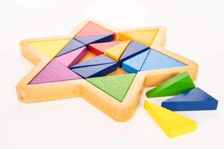 Wooden star puzzle on white background