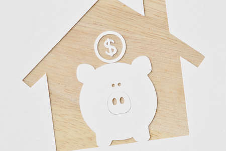 Piggy bank and buying a house project - Saving money for future conceptの写真素材