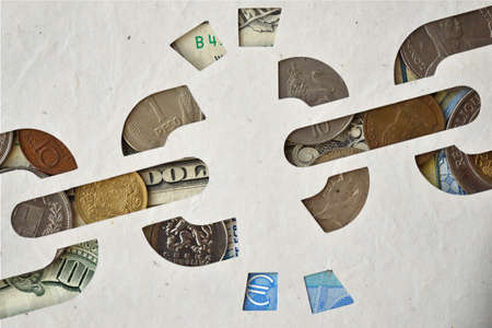 Broken chain paper cut-out on money background - Freedom from money addictionの写真素材