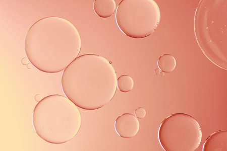 Water and oil on pink background - Abstract macroの写真素材