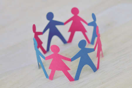 Paper men and women cut-out in a circle holding hands - Gender relationship conceptの写真素材