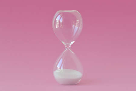 Hourglass on pink background - Concept of infertility and biological clock in womenの写真素材