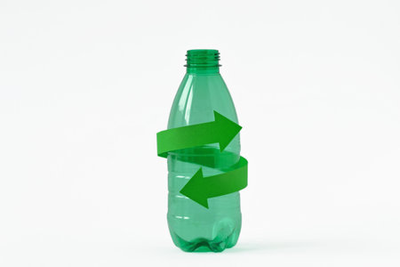 Plastic bottle with recycling symbol on white backgroundの写真素材