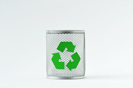 Trash basket with recycling symbol on white backgroundの写真素材