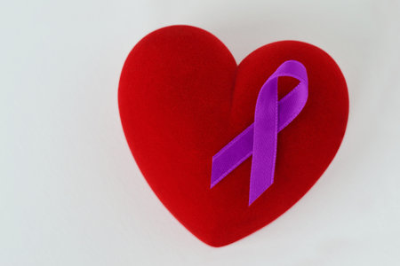 Heart with violet ribbon on white background - Concept of Domestic Violence awareness; Alzheimer's...