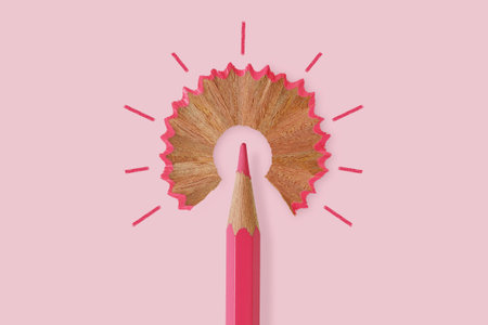 Pink pencil like a light bulb on pink background - Concept of women and creative thinkingの写真素材