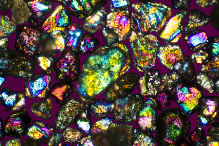 Polarization micrograph of a group of sand grains from a beach on Long Island Sound in Connecticut. Taken at 40x. The colors of refracted light make the sand grains look like jewels.の写真素材