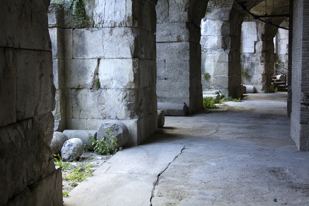 Stone walls and columns under the Roman Theater in Benevento Italy. This amphitheater was constructed by the emperor Hadrian in the second century AD.の写真素材